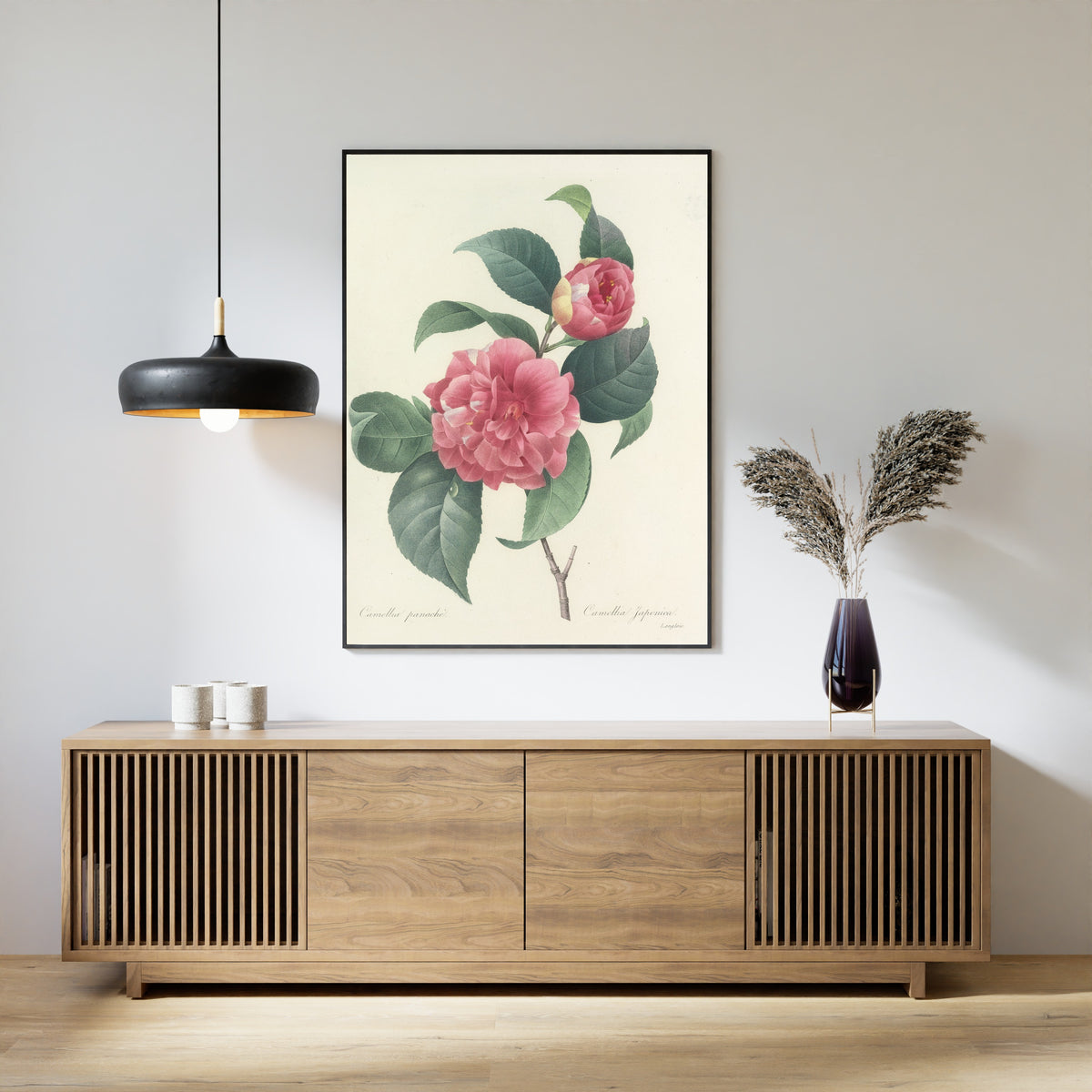 Framed art print of Choix des plus belles fleurs, Plate 18: Camellia Japonica by Pierre-Joseph Redouté, above a slatted wood sideboard