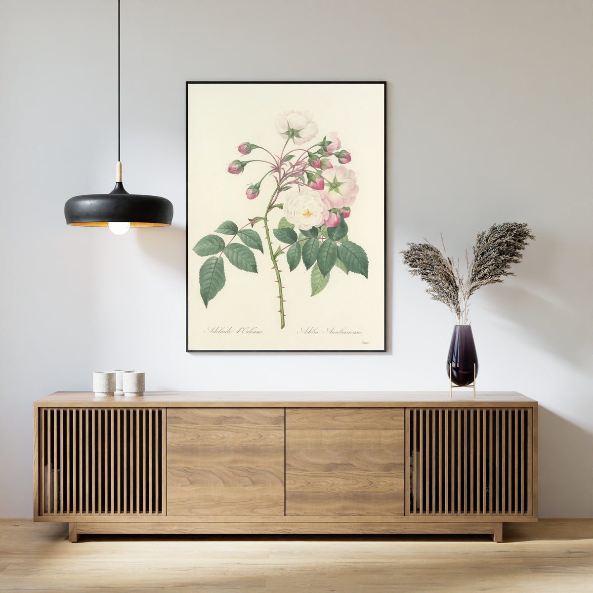 Framed art print of Choix des plus belles fleurs, Plate 2: Adelia Aurelianensis by Pierre-Joseph Redouté, above a slatted wood sideboard