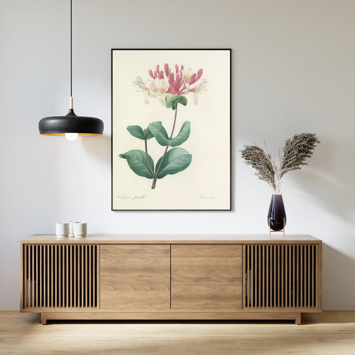 Framed art print of Choix des plus belles fleurs, Plate 23: Lonicera by Pierre-Joseph Redouté, above a slatted wood sideboard