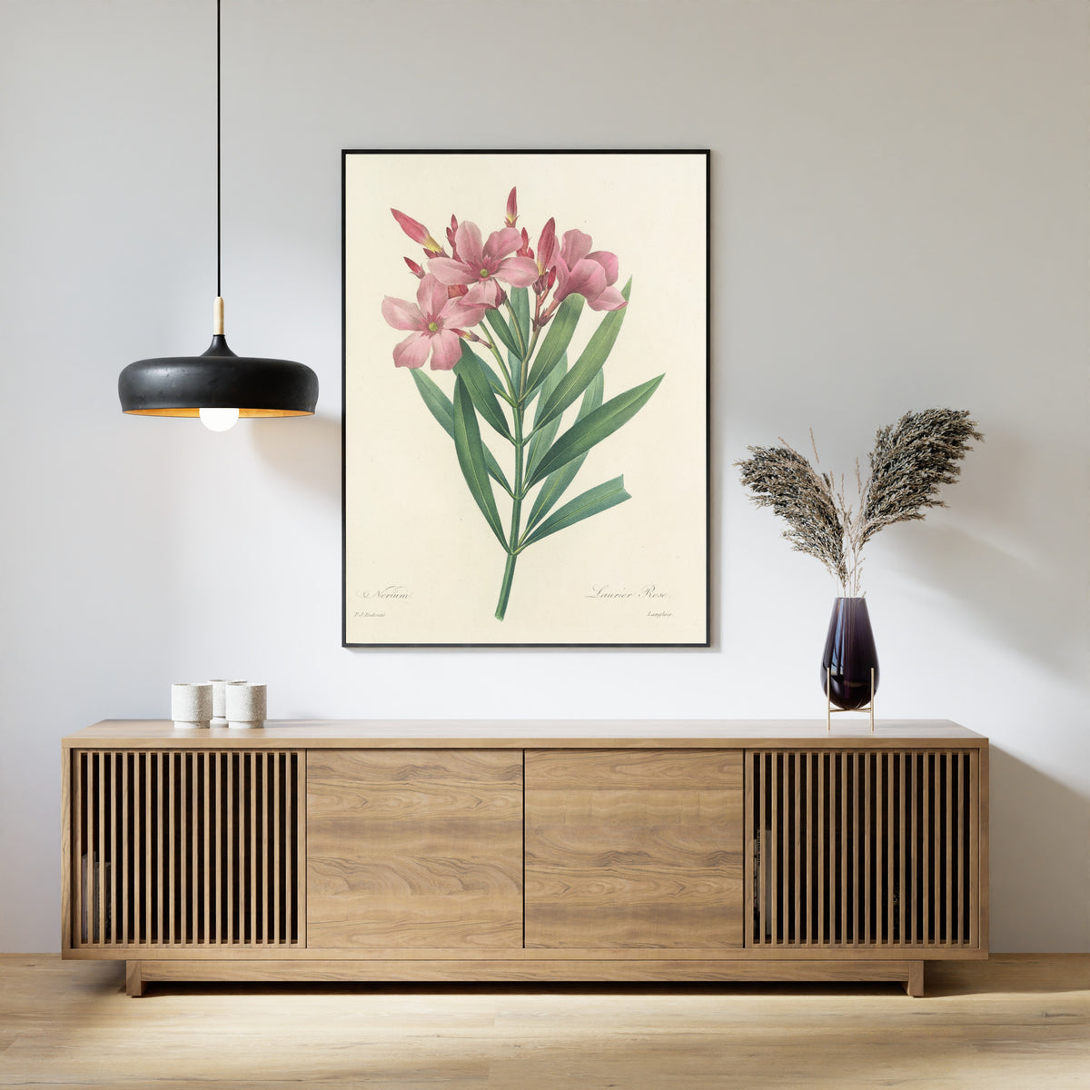 Framed art print of Choix des plus belles fleurs, Plate 40: Nerium by Pierre-Joseph Redouté, above a slatted wood sideboard