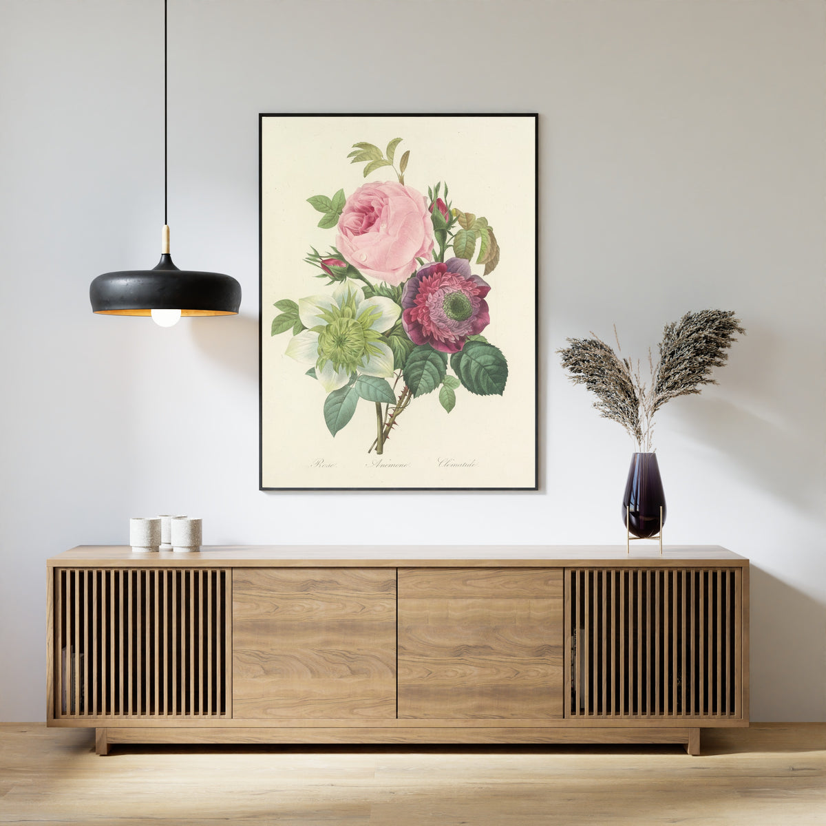 Framed art print of Choix des plus belles fleurs, Plate 95: Rose, Anémone and Clématide by Pierre-Joseph Redouté, above a slatted wood sideboard