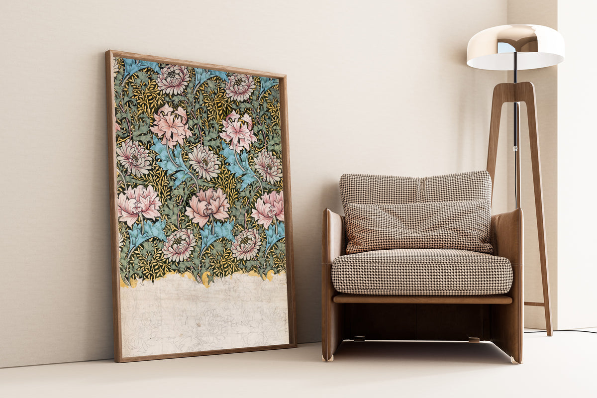 Framed art print of Chrysanthemum (Design Drawing) by William Morris, leaning against a wall beside an armchair and a floor lamp