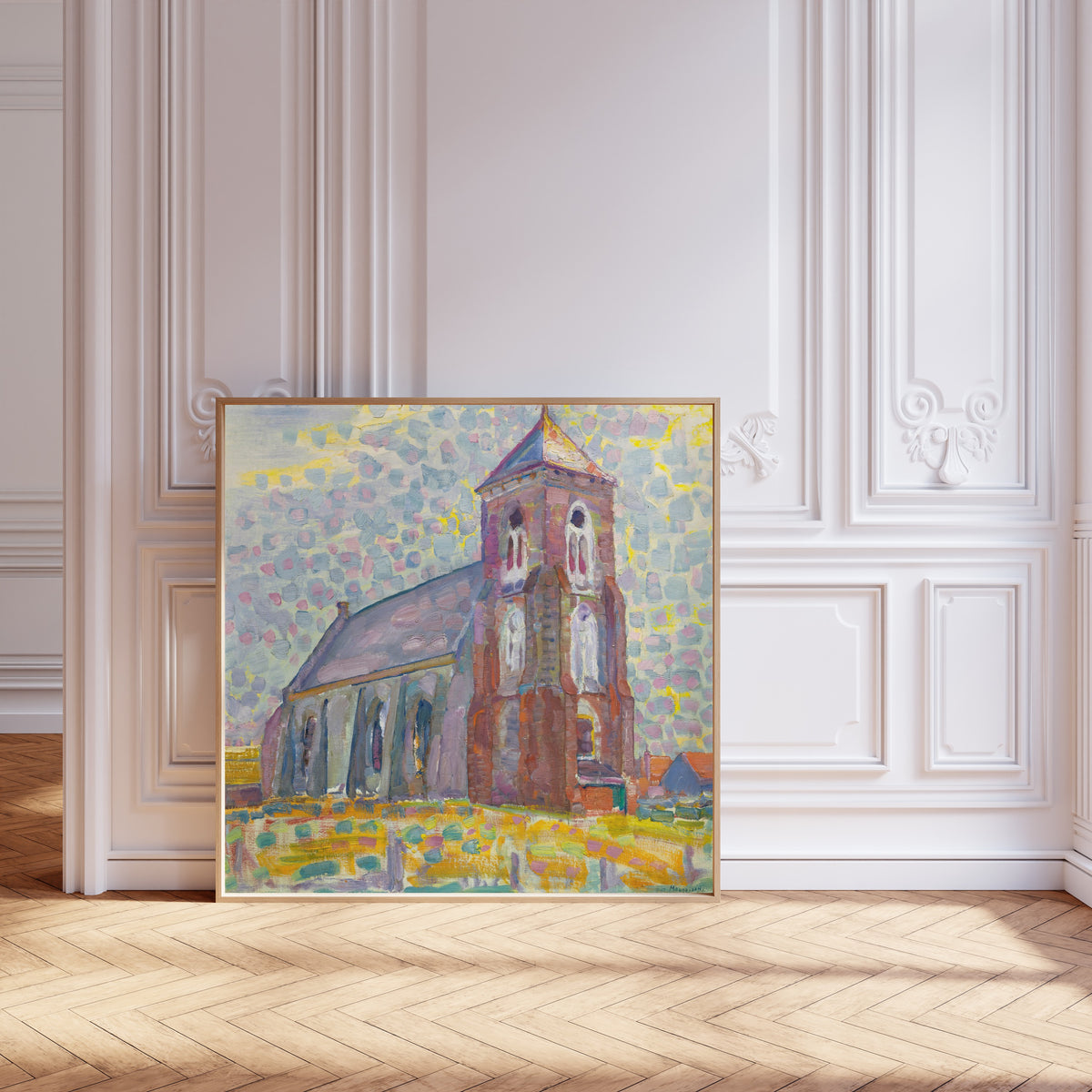 Framed art print of Church In Zoutelande by Piet Mondrian, leaning against pale pink panelling on a herringbone floor