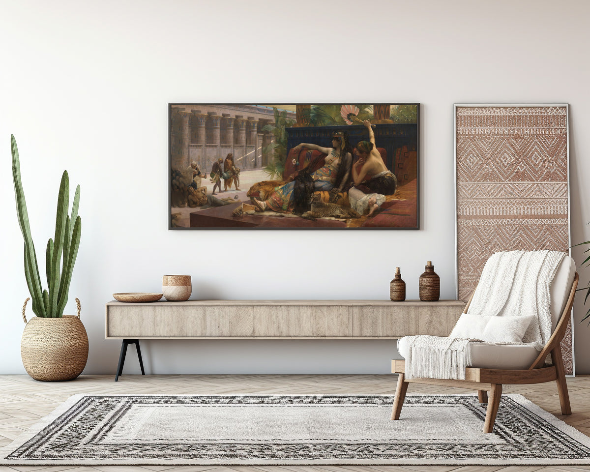 Framed art print of Cleopatra Testing Poisons on Condemned Prisoners by Alexandre Cabanel, above a sideboard in a living room