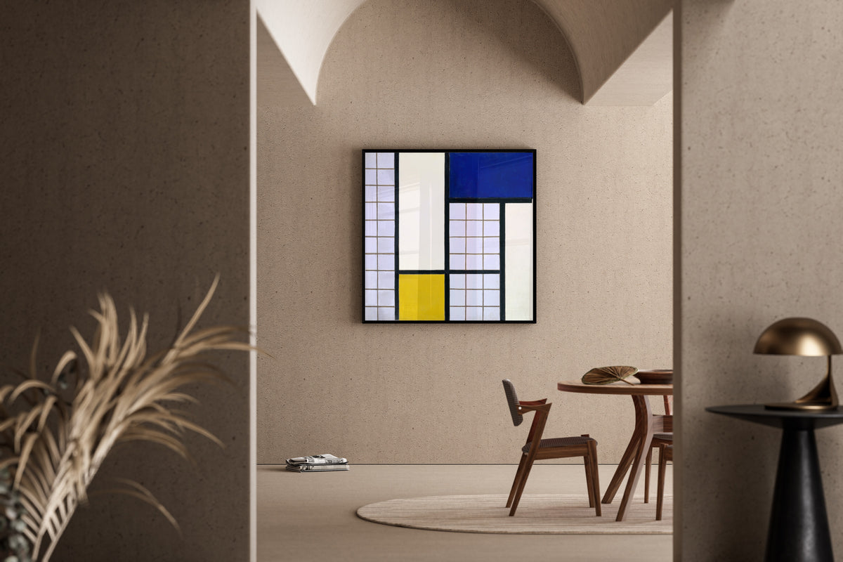 Framed art print of Composition in Half-Tones by Theo van Doesburg, in a sunlit dining corner
