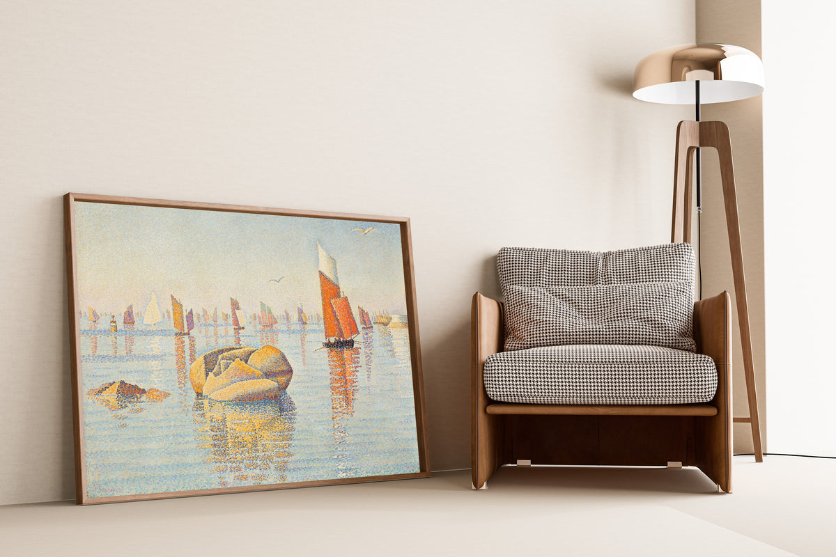 Framed art print of Concarneau, Morning Calm by Paul Signac, leaning against a wall beside an armchair and a floor lamp