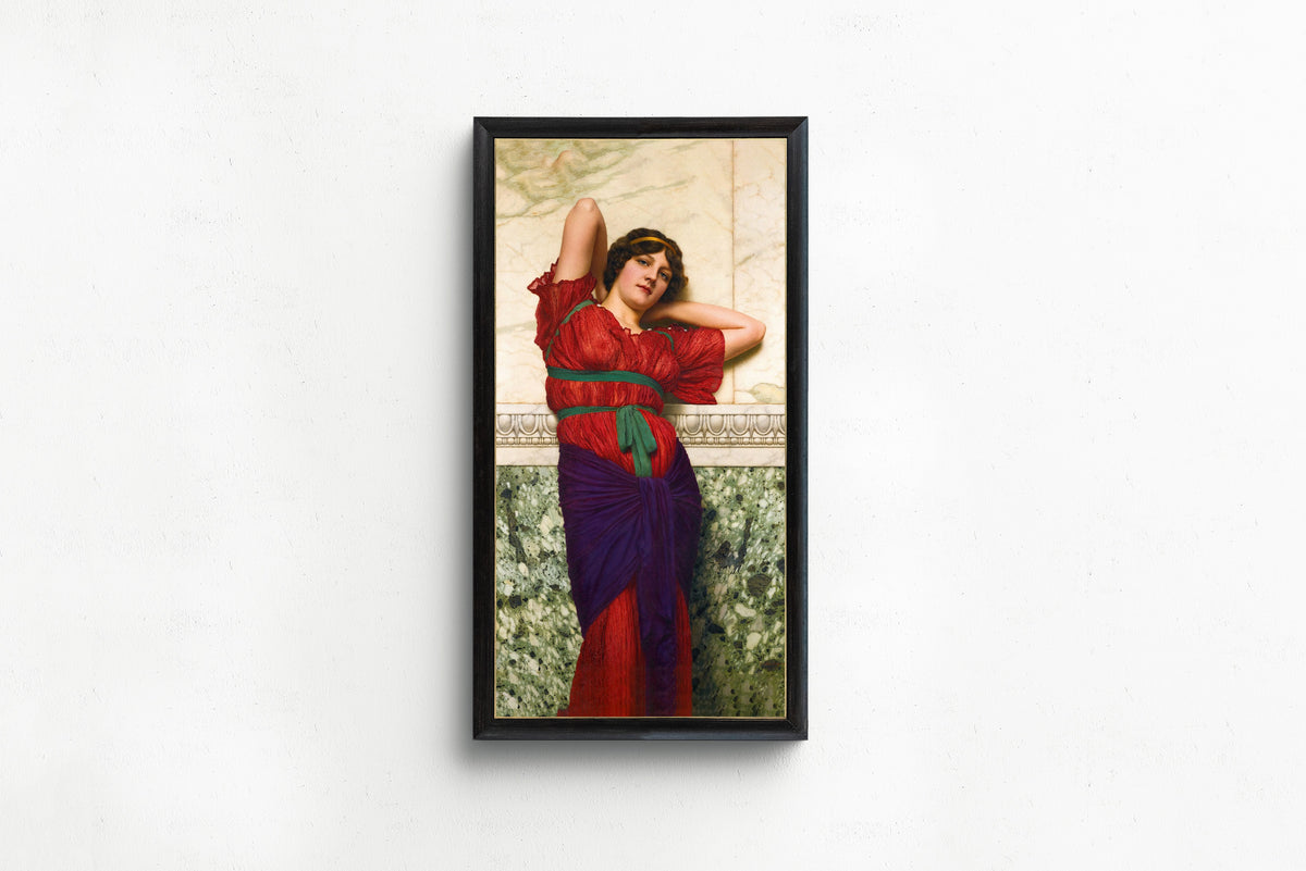 Framed art print of Contemplation by John William Godward, in a slim black frame on a plain white wall