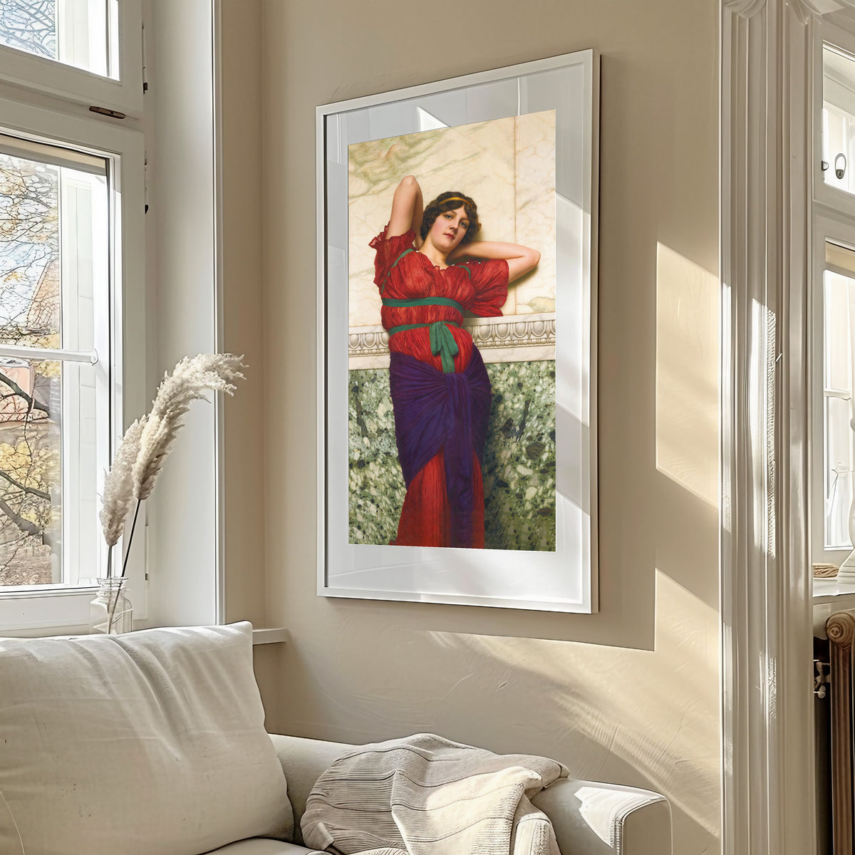 Framed art print of Contemplation by John William Godward, in a sunlit living room above a sofa