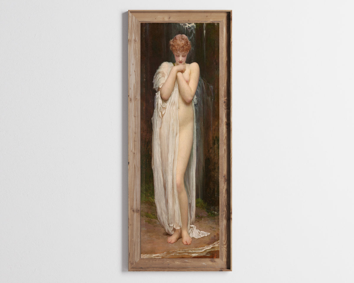 Framed art print of Crenaia, the Nymph of the Dargle by Frederic Leighton, in a tall wooden frame on a pale wall