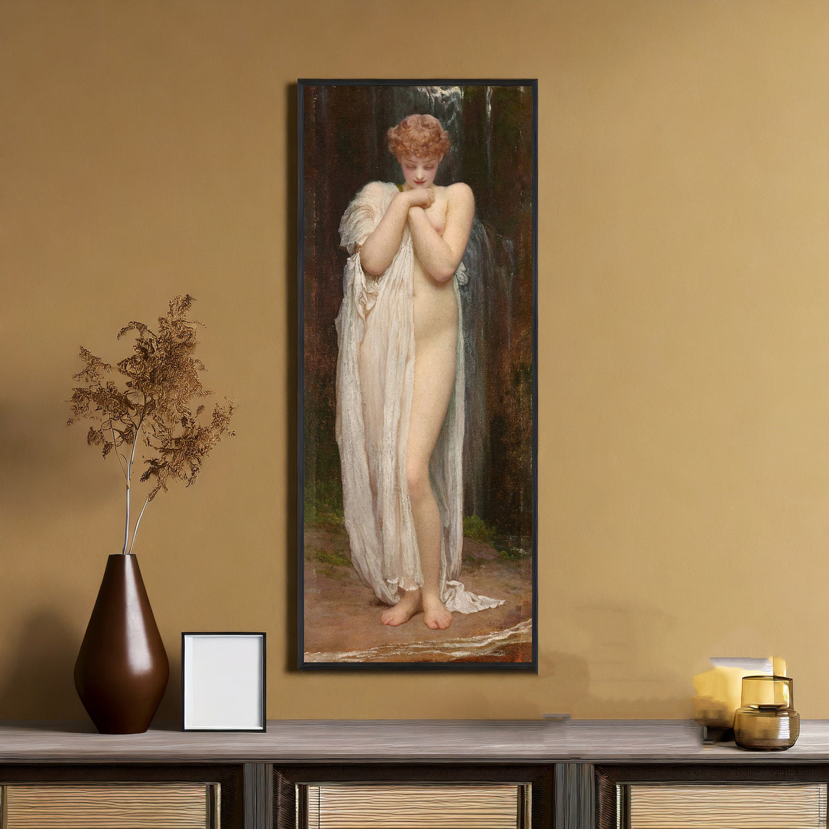 Framed art print of Crenaia, the Nymph of the Dargle by Frederic Leighton, on an ochre wall above a console table