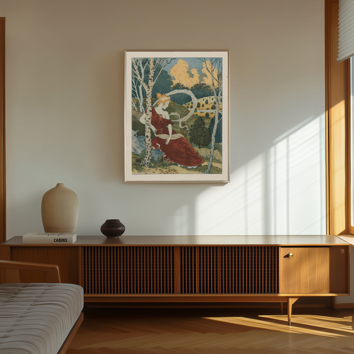 Framed art print of Dans Les Bois by Eugène Grasset, in a thin light frame on a sunlit wall above a wooden sideboard