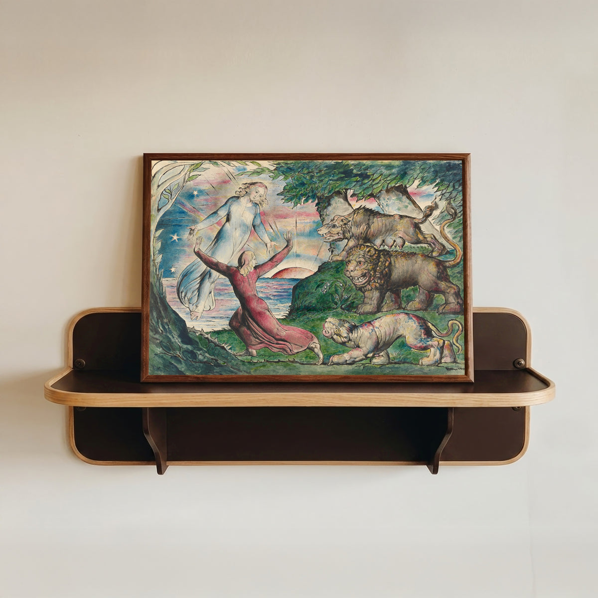 Framed art print of Dante Running from the Three Beasts by William Blake, in a dark wood frame resting on a wall shelf