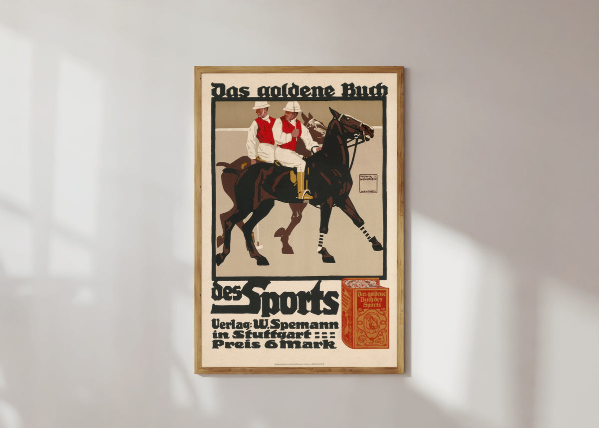 Framed art print of Das goldene Buch des Sports by Ludwig Hohlwein, in a light wood frame on a sunlit white wall