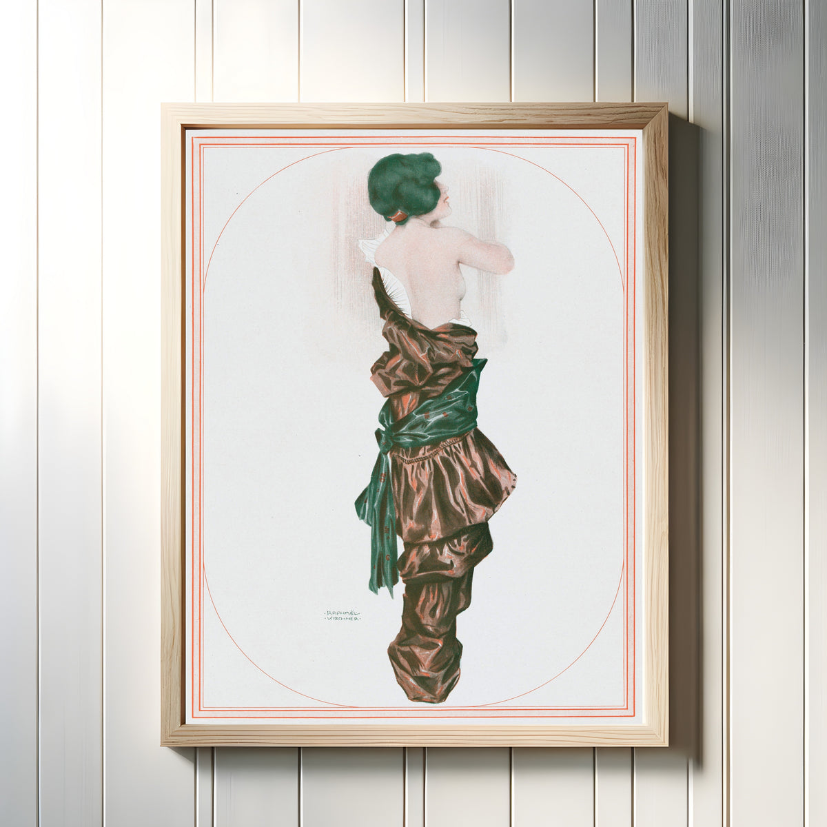 Framed art print of De la Brune à la Blonde, Pl. 6: La Perruque Verte by Raphael Kirchner, in a light wood frame on a white panelled wall
