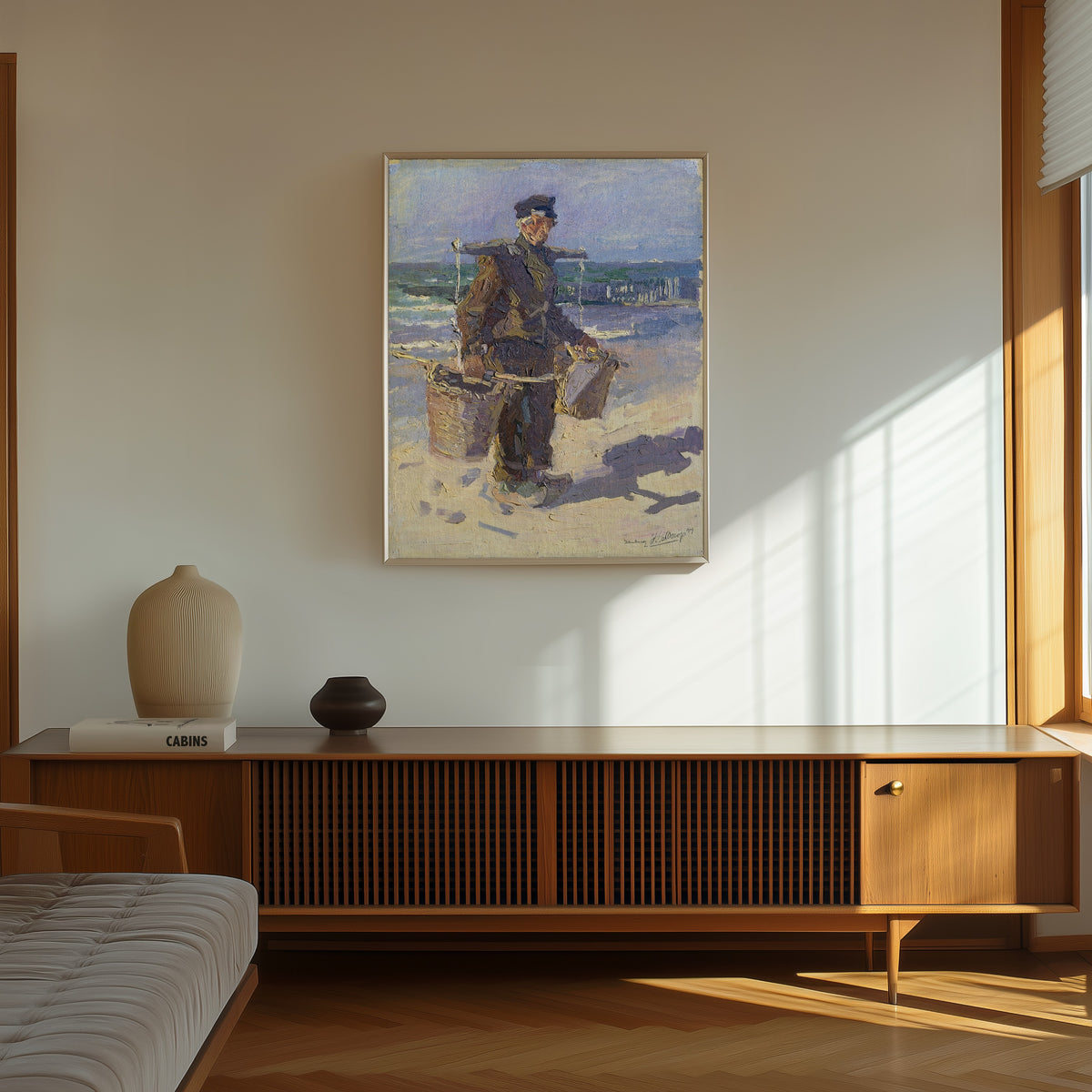 Framed art print of De schelpenvisser by Jan Toorop, in a thin light frame on a sunlit wall above a wooden sideboard