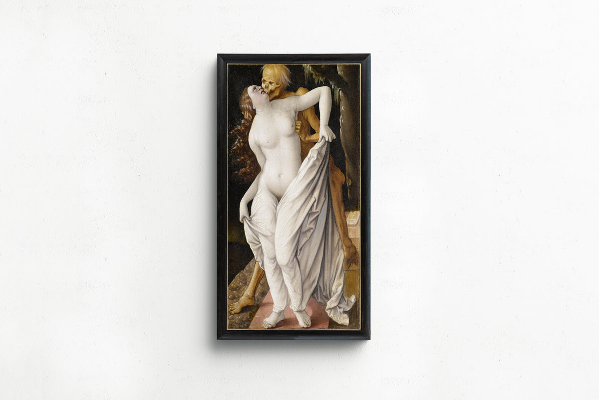Framed art print of Death and the Maiden by Hans Baldung Grien, in a slim black frame on a plain white wall