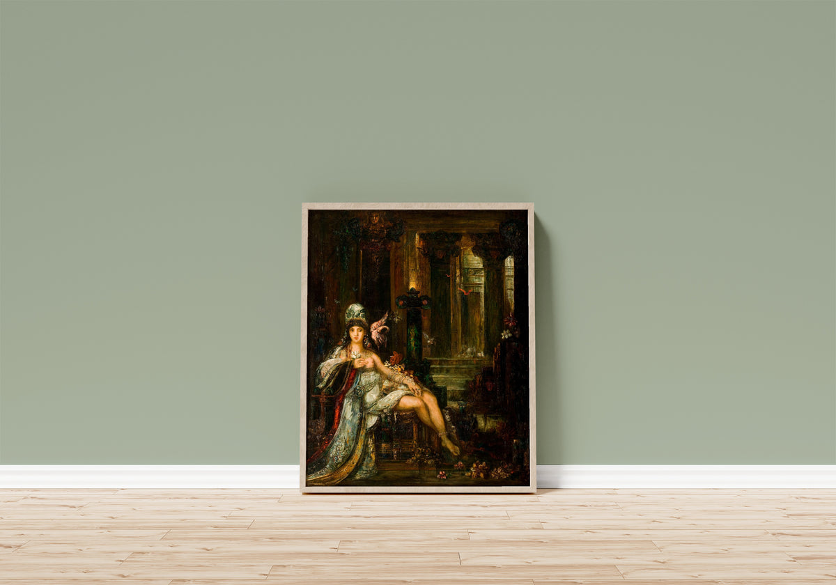 Framed art print of Delilah by Gustave Moreau, in a light wood frame leaning on a sage green wall above a wooden floor