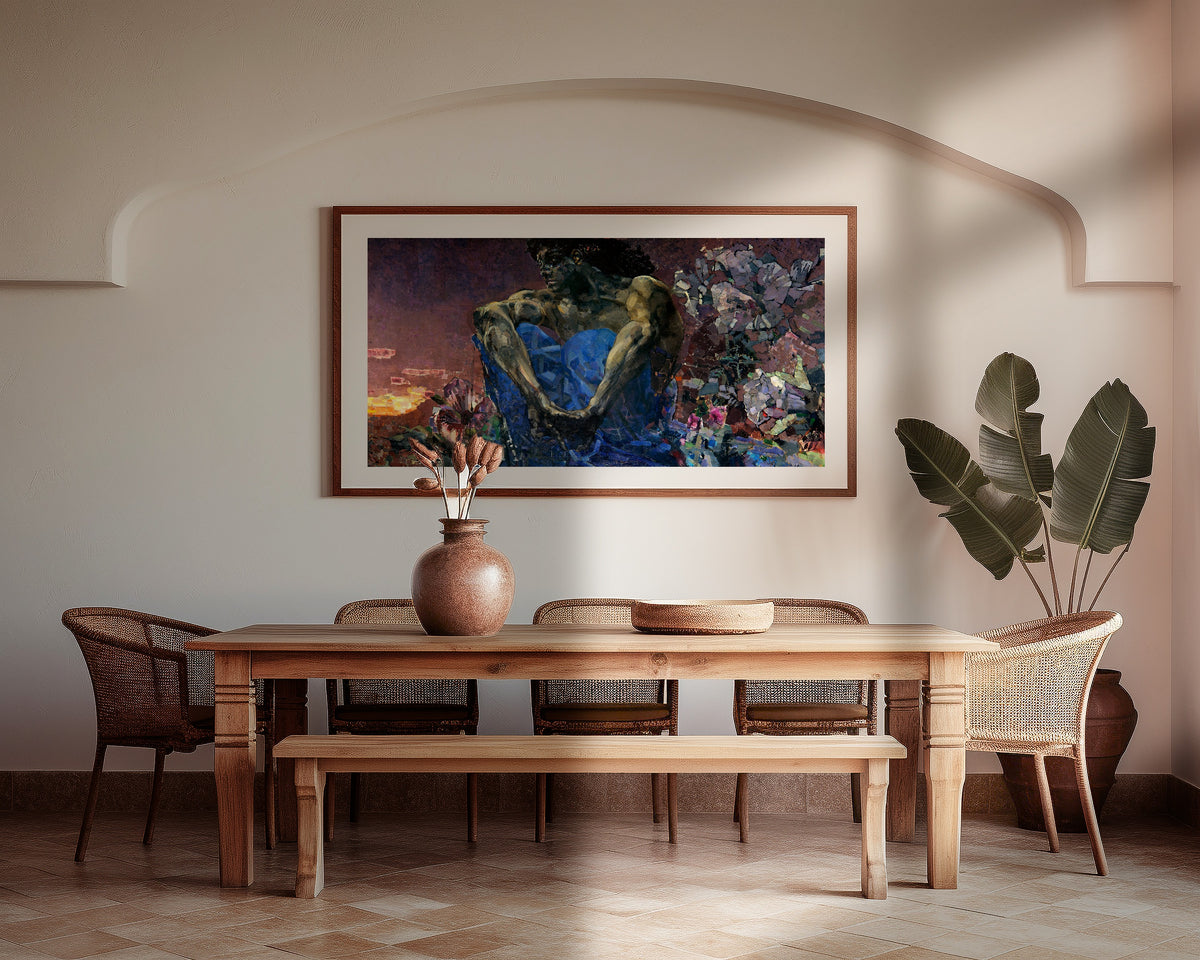 Framed art print of Demon Seated by Mikhail Vrubel, above a wooden dining table