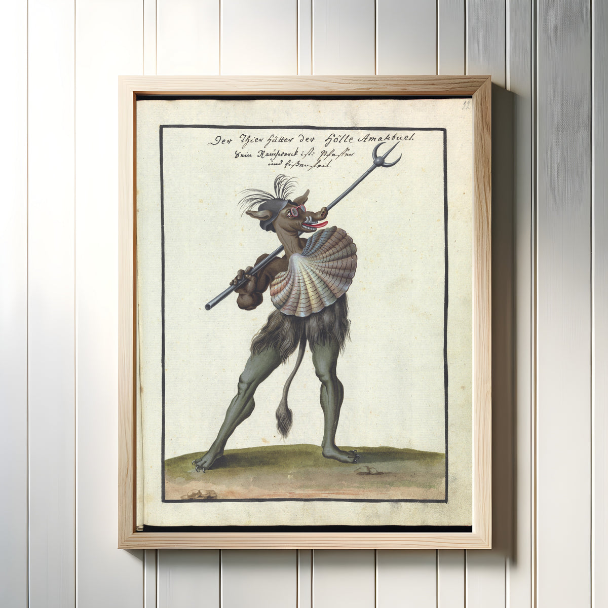 Framed art print of Der Thier hütter der Hölle Amakbuel (The Beast-Keeper of Hell) by Unknown artist, in a light wood frame on a white panelled wall