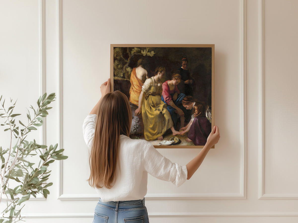 Framed art print of Diana and Her Nymphs by Johannes Vermeer, hung on a panelled wall