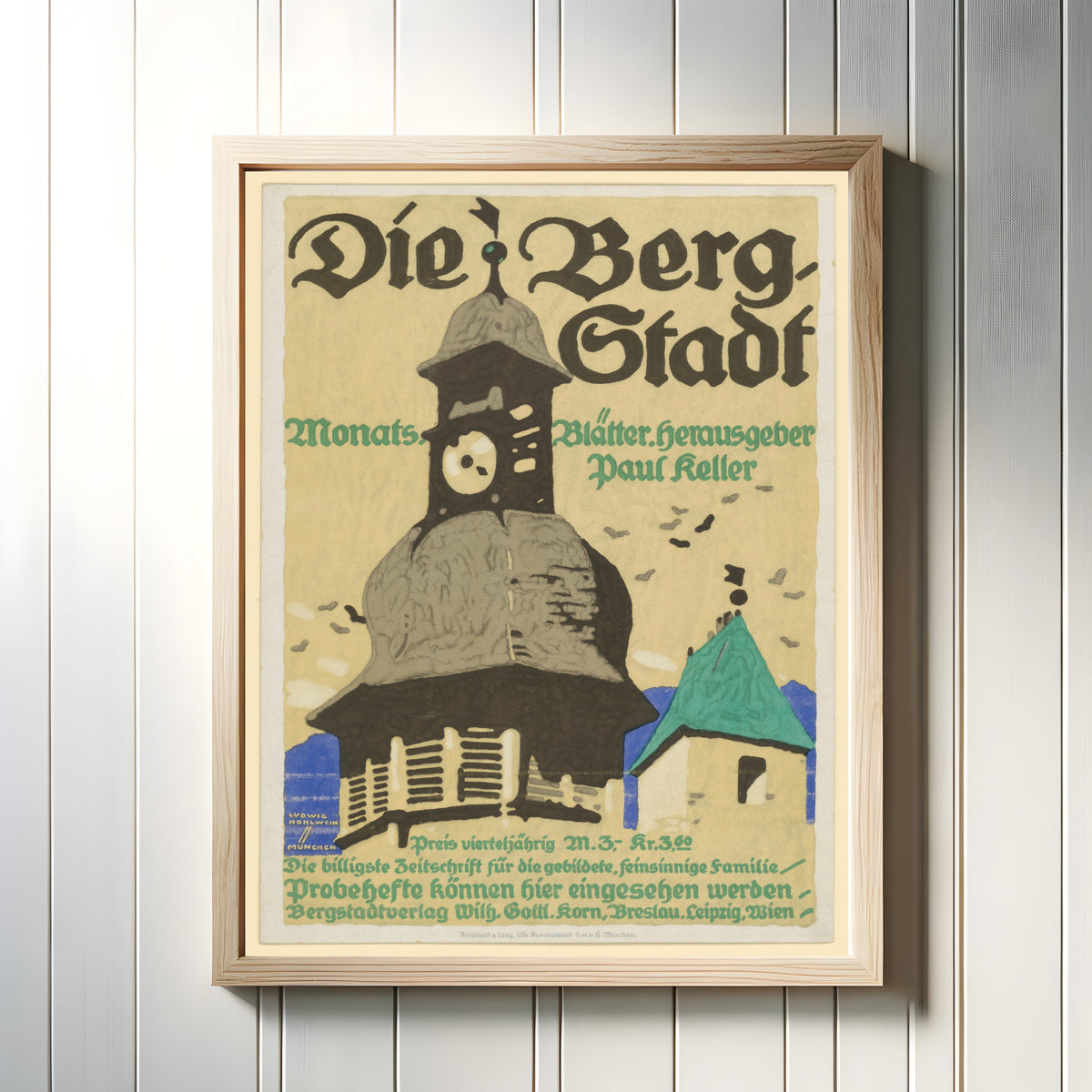 Framed art print of Die Bergstadt: Monatsblätter by Ludwig Hohlwein, in a light wood frame on a white panelled wall