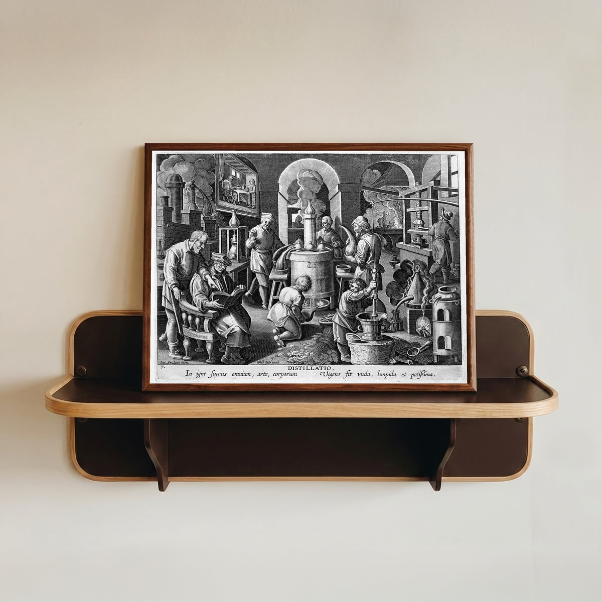 Framed art print of Distillatio: the Alchemist's Laboratory (Nova… by Philips Galle after Jan van der Straet, in a dark wood frame resting on a wall shelf