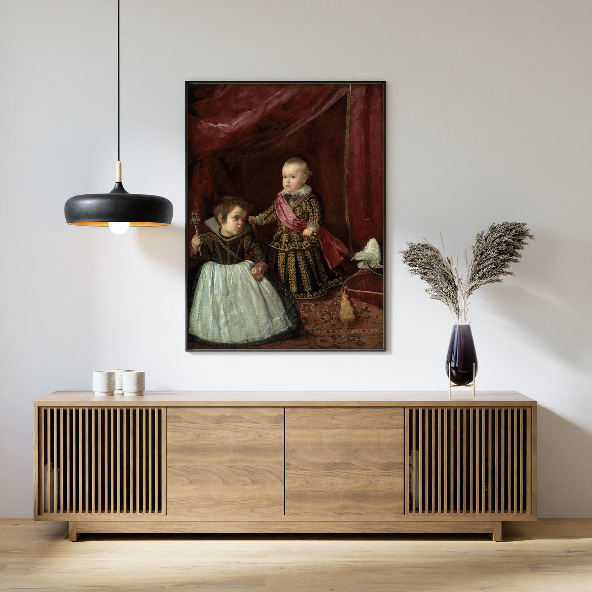 Framed art print of Don Baltasar Carlos with a Dwarf by Diego Velázquez, above a slatted wood sideboard