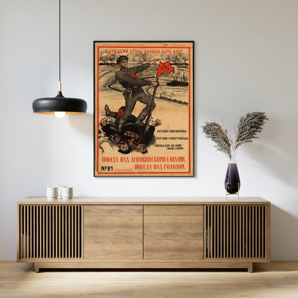 Framed art print of Donetsk Coal Must Be Ours! by Vasily Spasskiy, above a slatted wood sideboard
