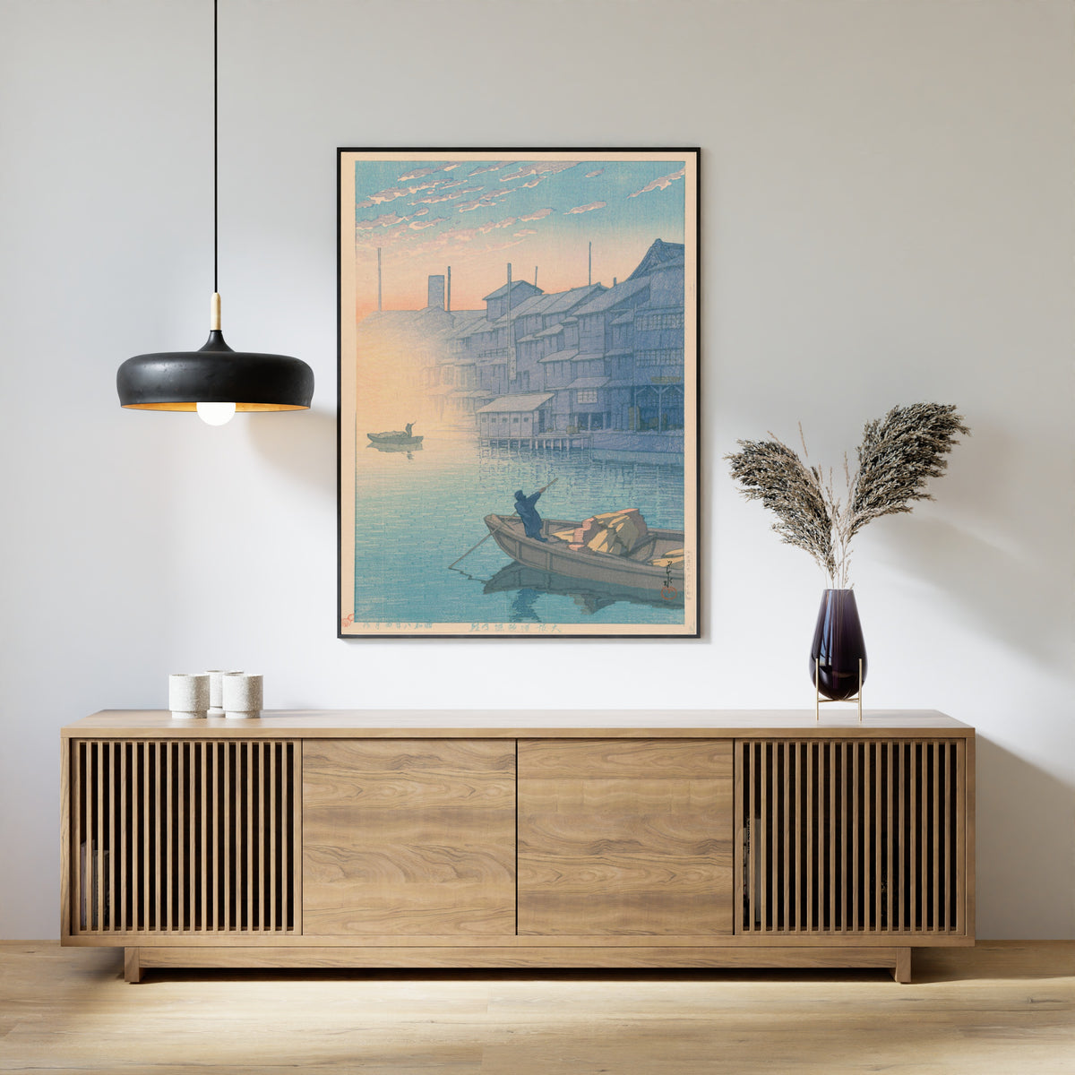 Framed art print of Dotonbori, Osaka, in the Morning (Kansai Series) by Kawase Hasui, above a slatted wood sideboard