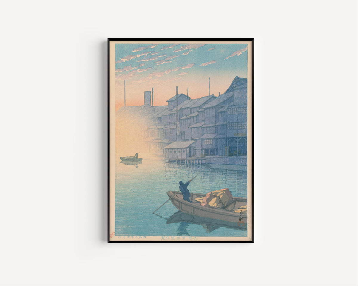 Framed art print of Dotonbori, Osaka, in the Morning (Kansai Series) by Kawase Hasui, in a slim black frame on a plain white wall