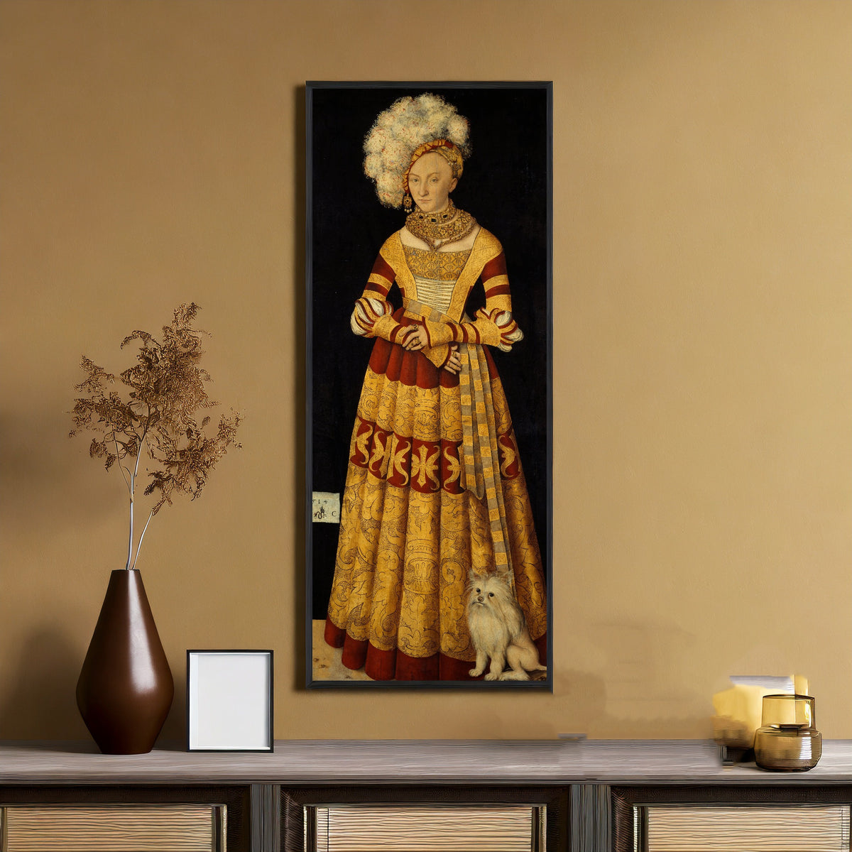 Framed art print of Duchess Katharina von Mecklenburg by Lucas Cranach the Elder, on an ochre wall above a console table