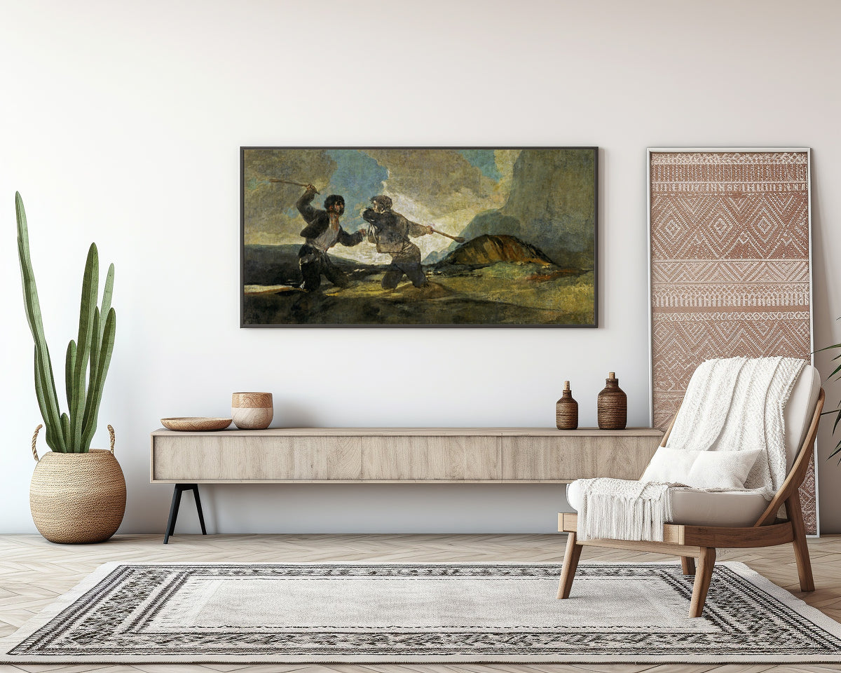 Framed art print of Duelo a garrotazos (Fight with Cudgels) by Francisco de Goya, above a sideboard in a living room