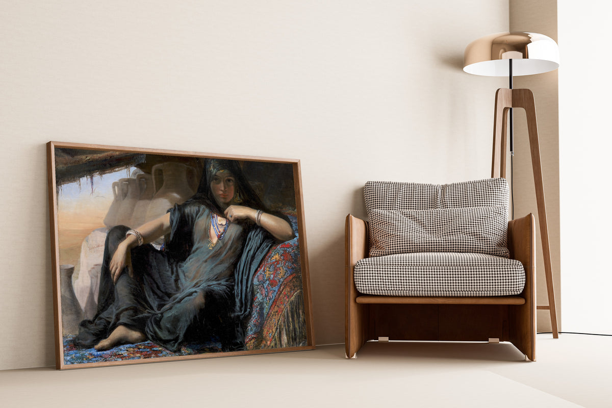 Egyptian Pot Seller by Elisabeth Jerichau-Baumann — framed and leaning against a wall beside an armchair and a floor lamp