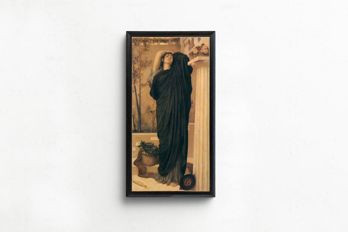 Framed art print of Electra at the Tomb of Agamemnon by Frederic Leighton, in a slim black frame on a plain white wall