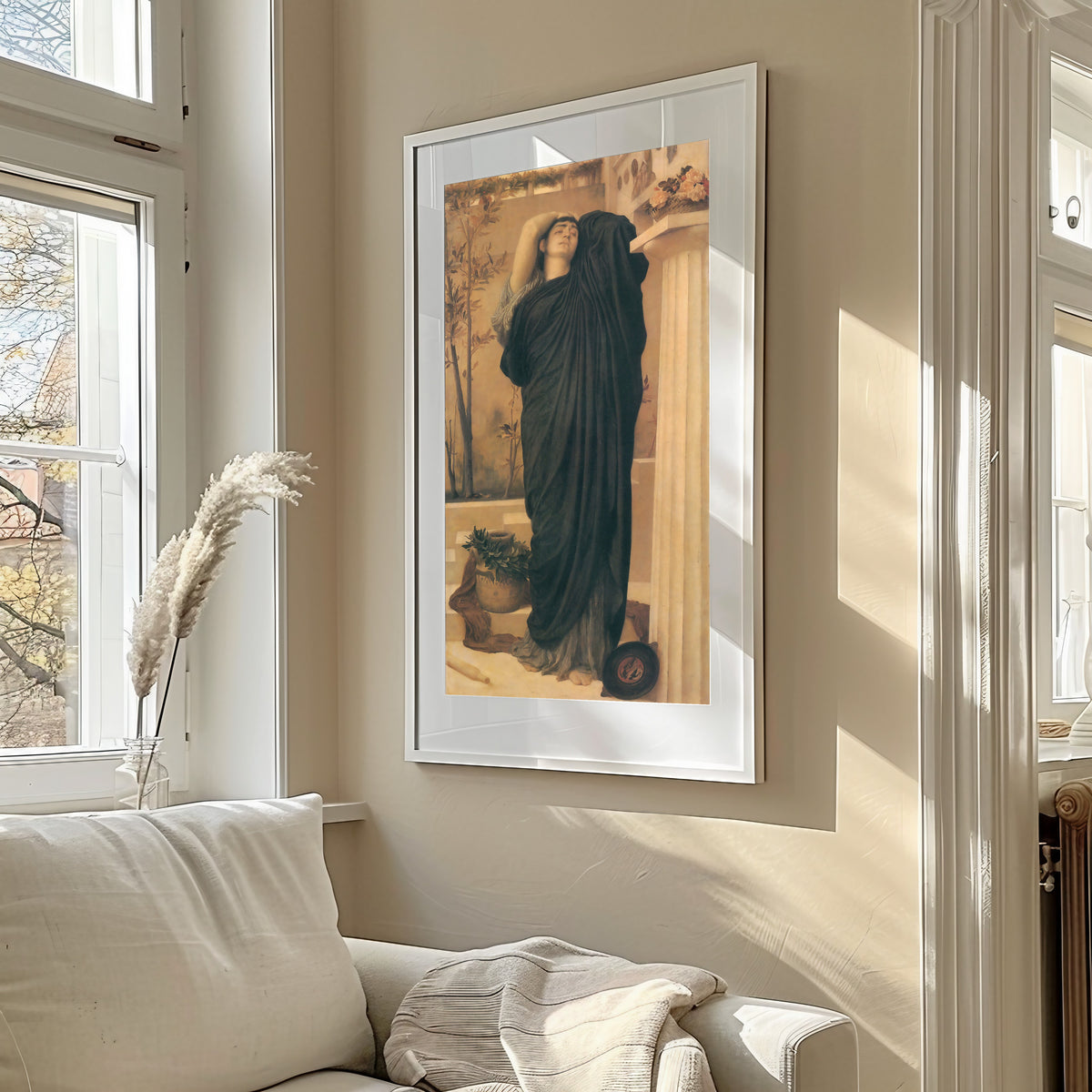 Framed art print of Electra at the Tomb of Agamemnon by Frederic Leighton, in a sunlit living room above a sofa
