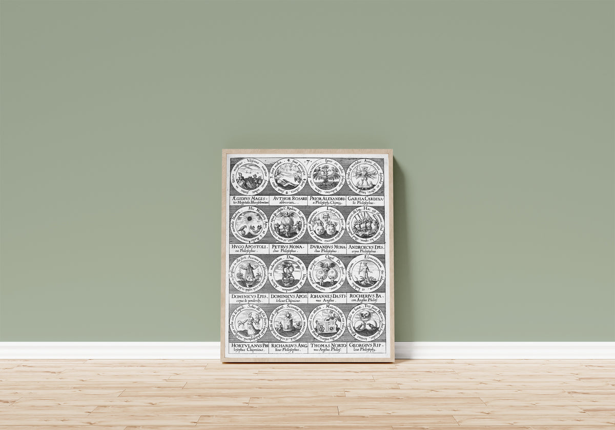 Framed art print of Emblems of Sixteen Alchemic Philosophers… by Johann Daniel Mylius, in a light wood frame leaning on a sage green wall above a wooden floor