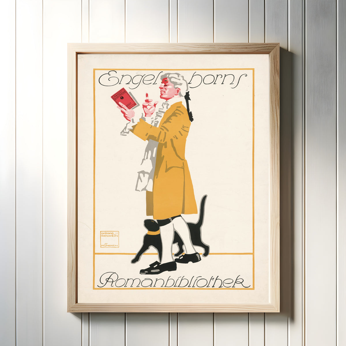 Framed art print of Engelhorns Romanbibliothek by Ludwig Hohlwein, in a light wood frame on a white panelled wall