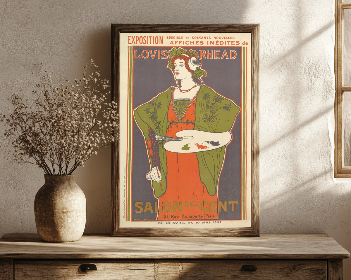 Framed art print of Exposition, Salon des Cent by Louis Rhead, in a dark wood frame leaning on a rustic console beside dried flowers