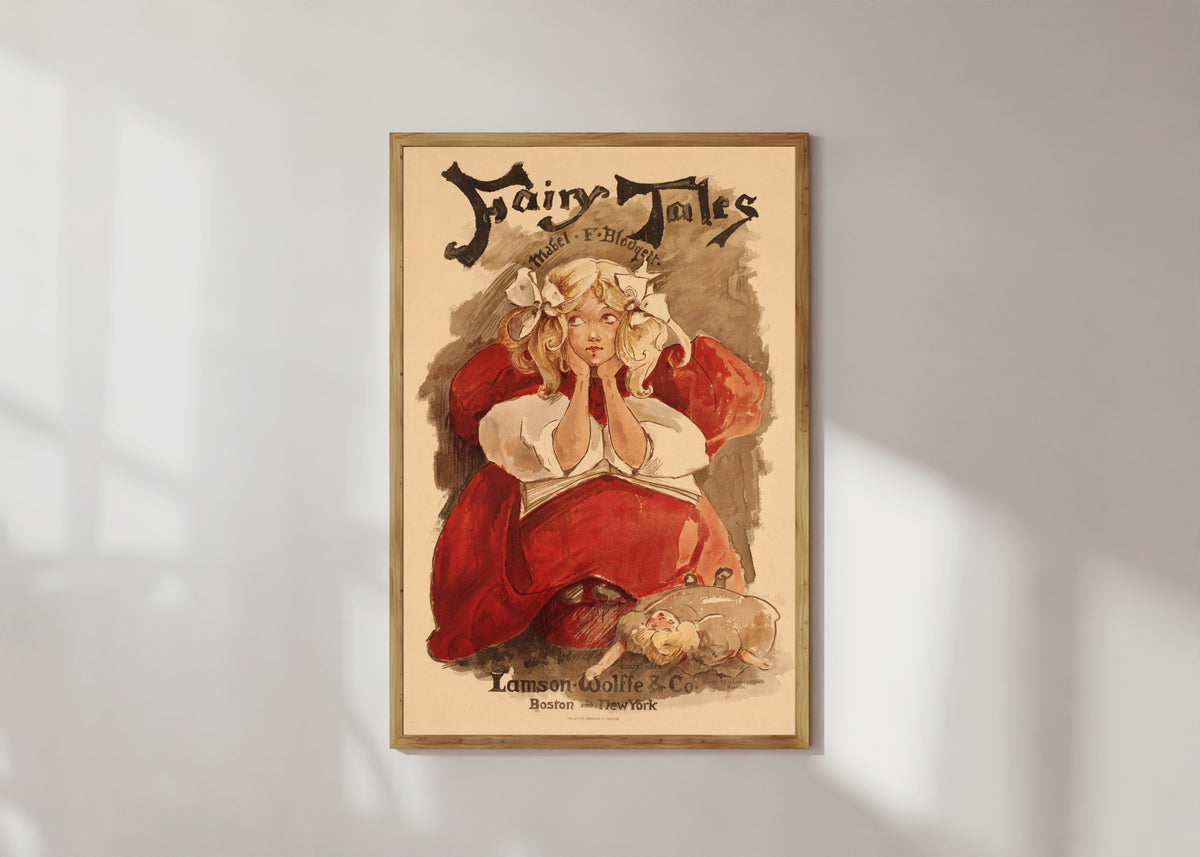 Framed art print of Fairy Tales by Mabel F. Blodgett by Ethel Reed, in a light wood frame on a sunlit white wall