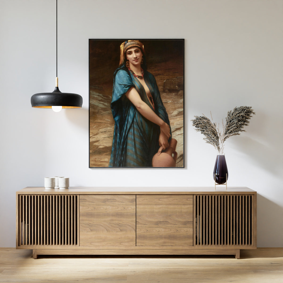 Fetching Water by Charles Landelle — framed above a slatted wood sideboard