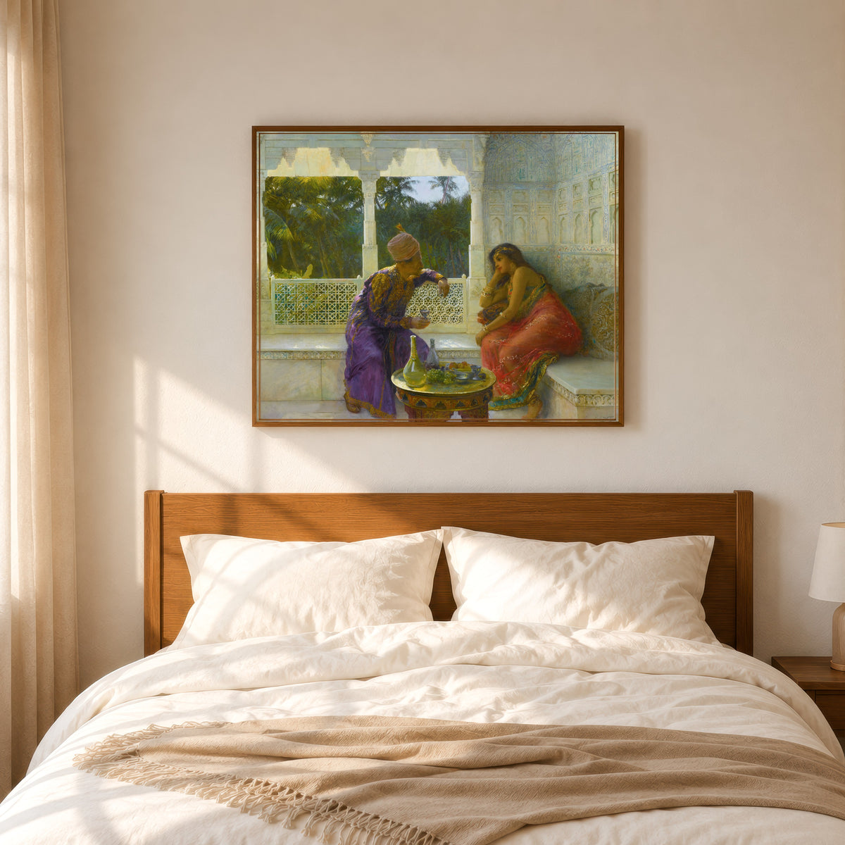 Framed art print of Figures in an Interior with Garden of Palms Beyond by Edwin Lord Weeks, in a slim wood frame above a bed in a sunlit bedroom