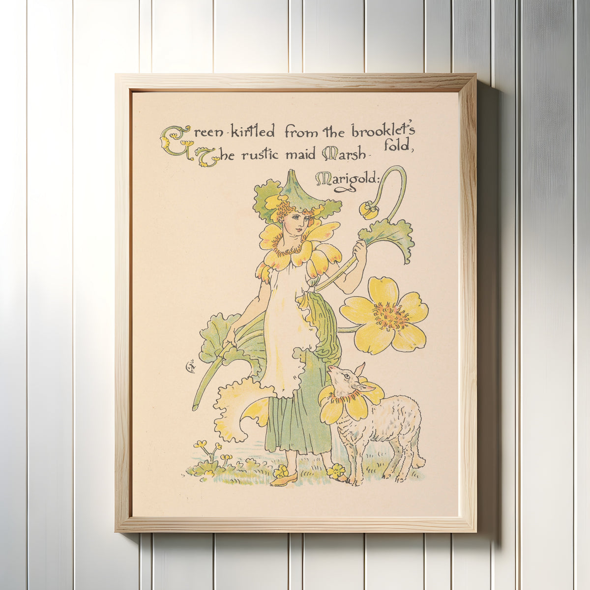 Framed art print of Flora's Feast: Marsh-Marigold by Walter Crane, in a light wood frame on a white panelled wall
