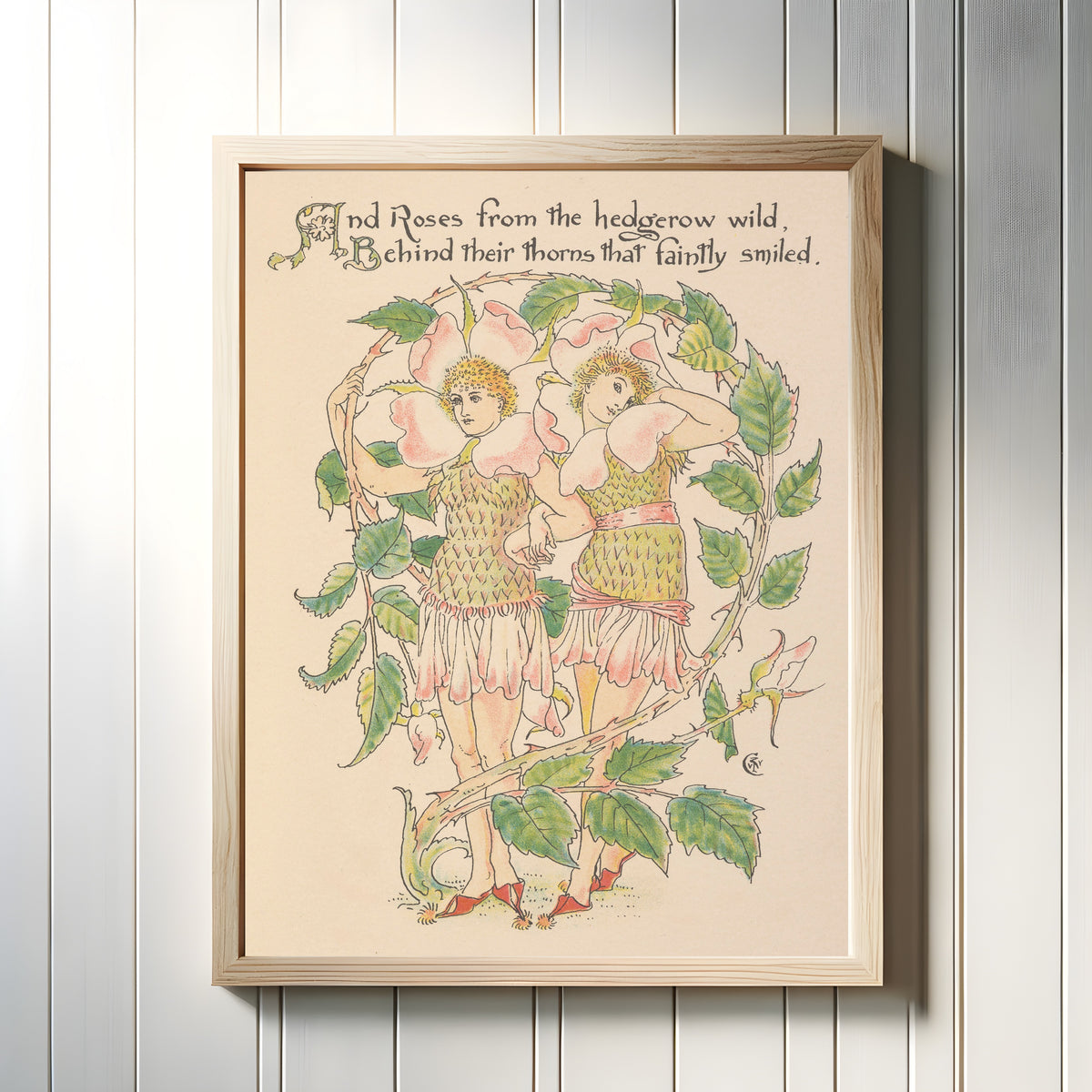Framed art print of Flora's Feast: Wild Roses by Walter Crane, in a light wood frame on a white panelled wall