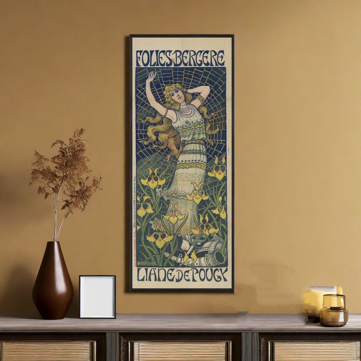 Framed art print of Folies Bergère: Liane de Pougy by Paul Berthon, on an ochre wall above a console table