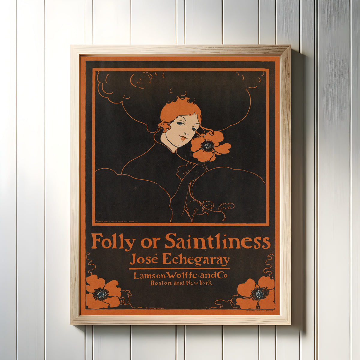 Framed art print of Folly or Saintliness by José Echegaray by Ethel Reed, in a light wood frame on a white panelled wall