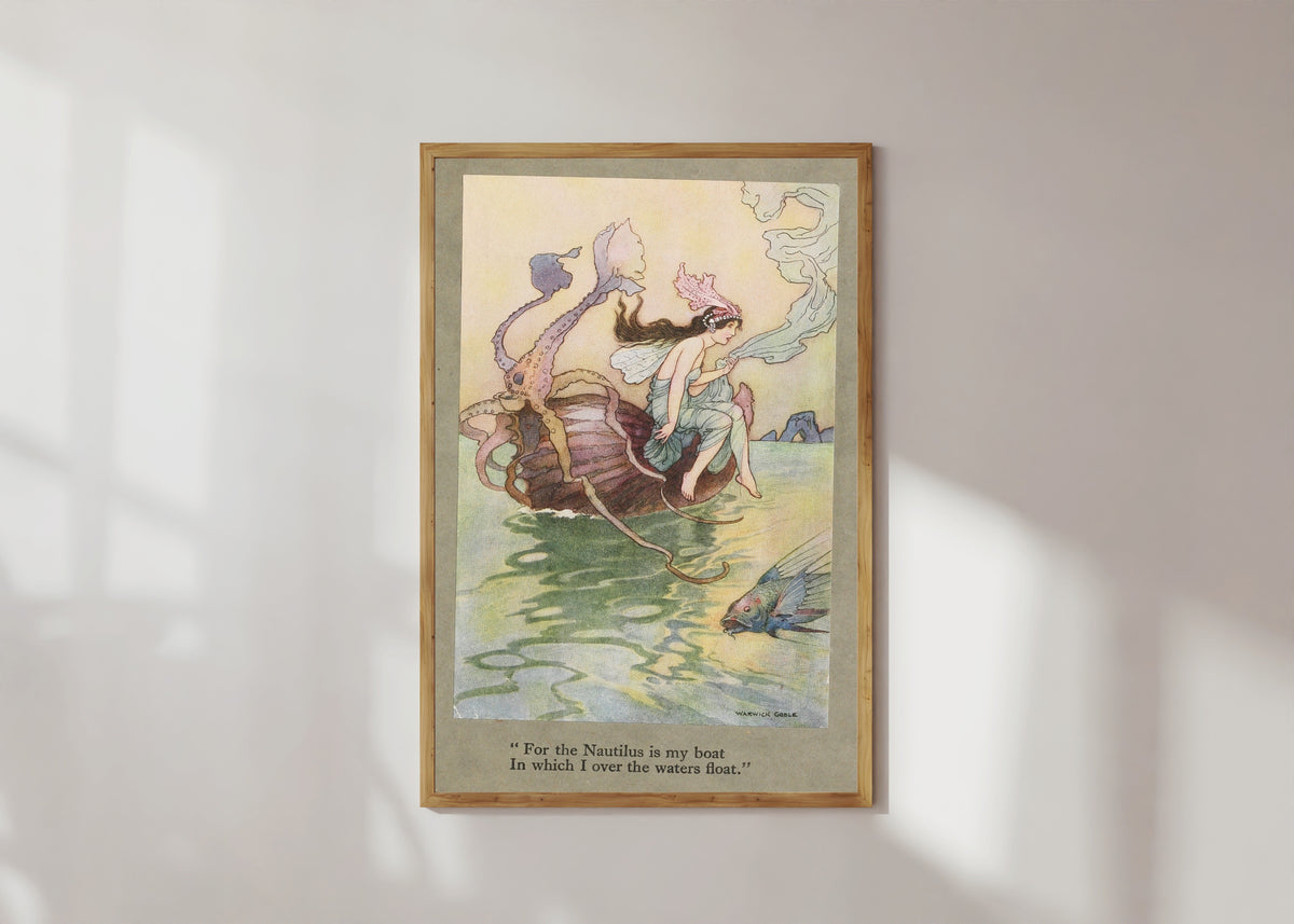 Framed art print of For the Nautilus is my boat in which I over the waters float. by Warwick Goble, in a light wood frame on a sunlit white wall