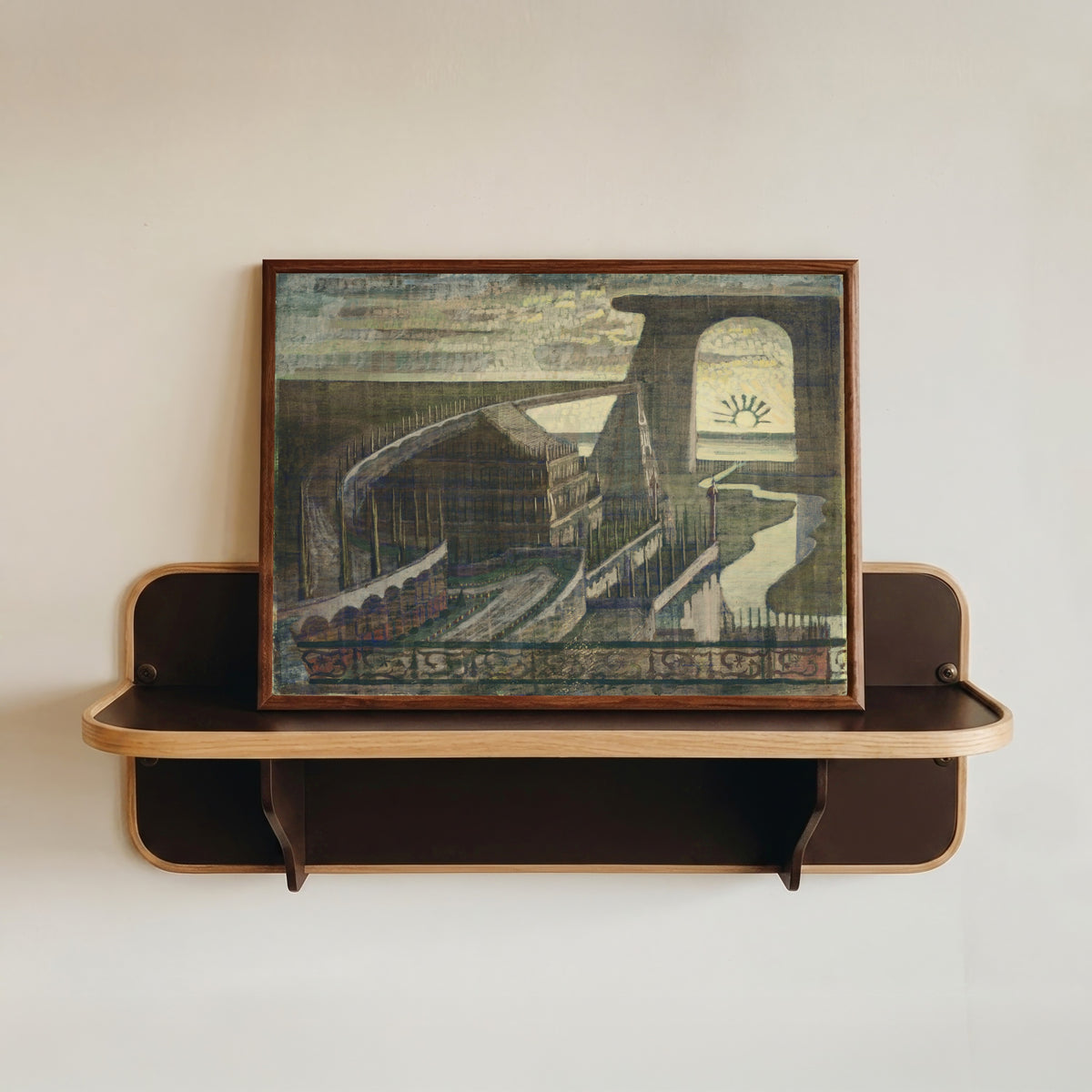 Framed art print of Fortress by Mikalojus Konstantinas Čiurlionis, in a dark wood frame resting on a wall shelf
