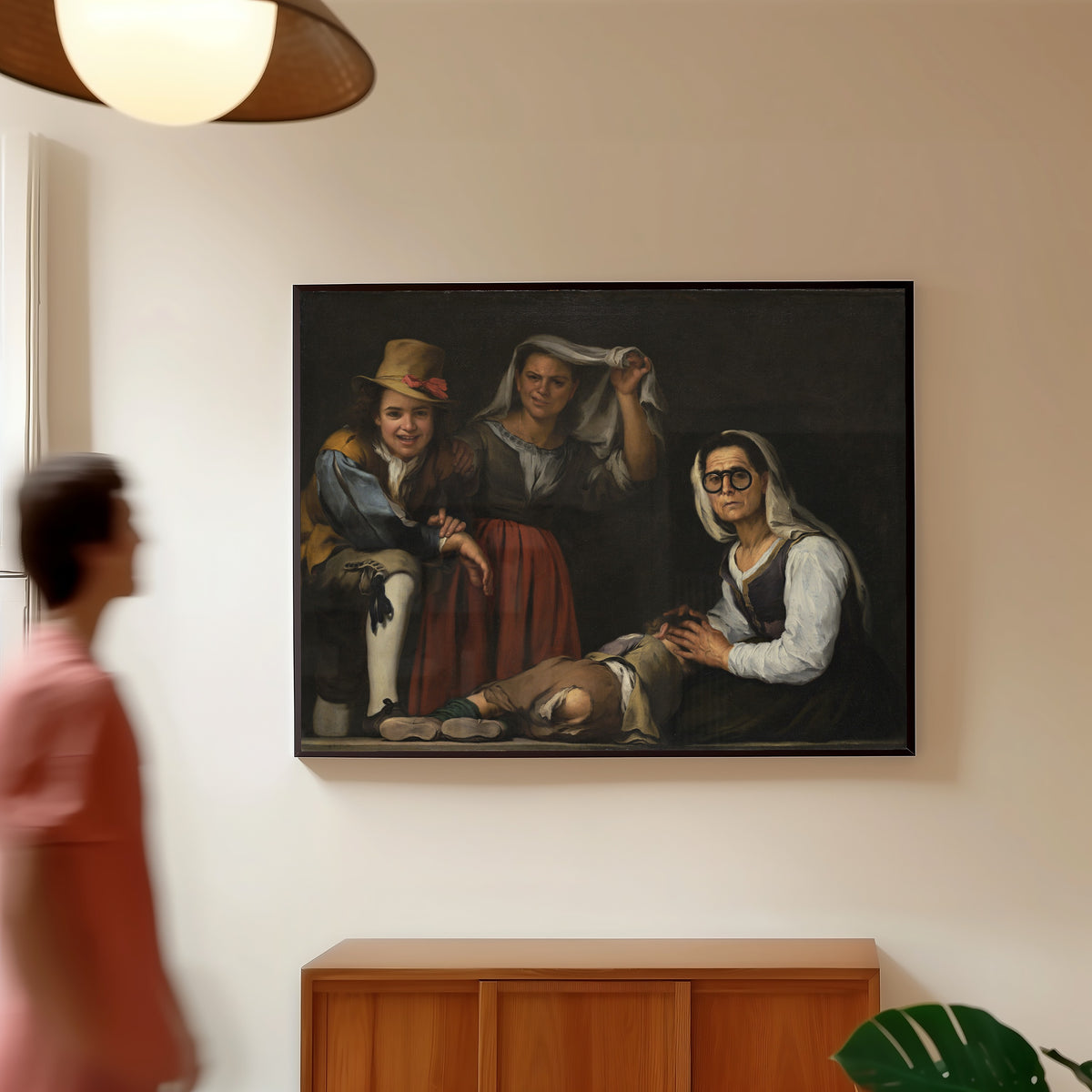 Framed art print of Four Figures on a Step by Bartolomé Esteban Murillo, in a slim black frame on a warm wall in a sunlit room