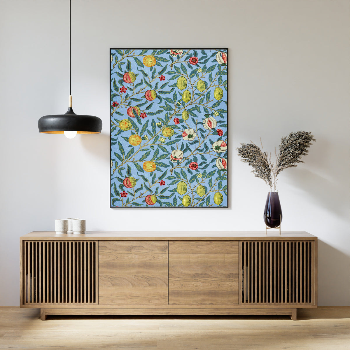Framed art print of Four Fruits by William Morris, above a slatted wood sideboard