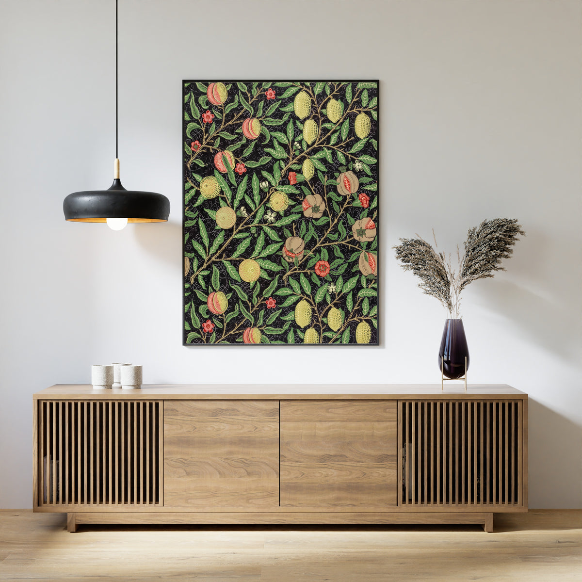 Framed art print of Fruit by William Morris, above a slatted wood sideboard